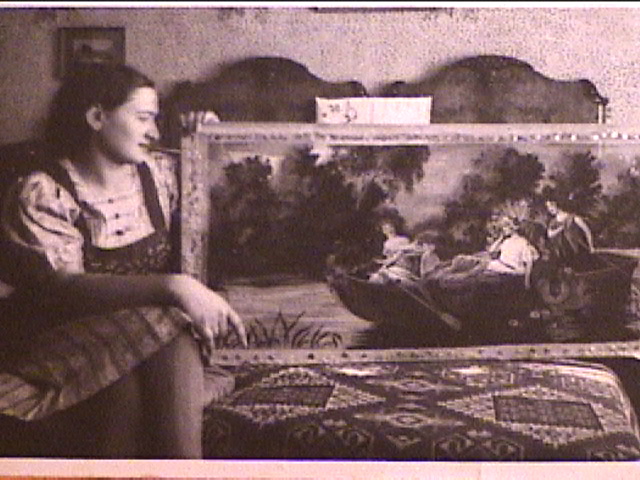 Klari in the guest bedroom in Sáránd c 1942, with the fine needlepoint she worked on for two years.